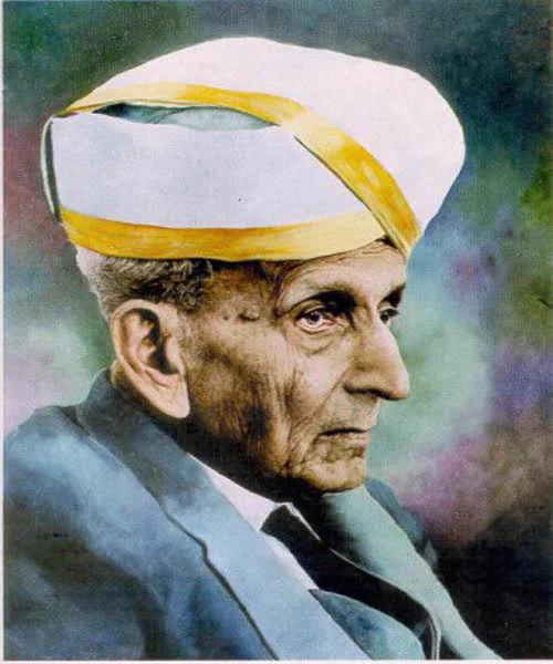 Sir M. Visvesvaraya in later life, in a white and gold turban and a grey coat, turned to his left.